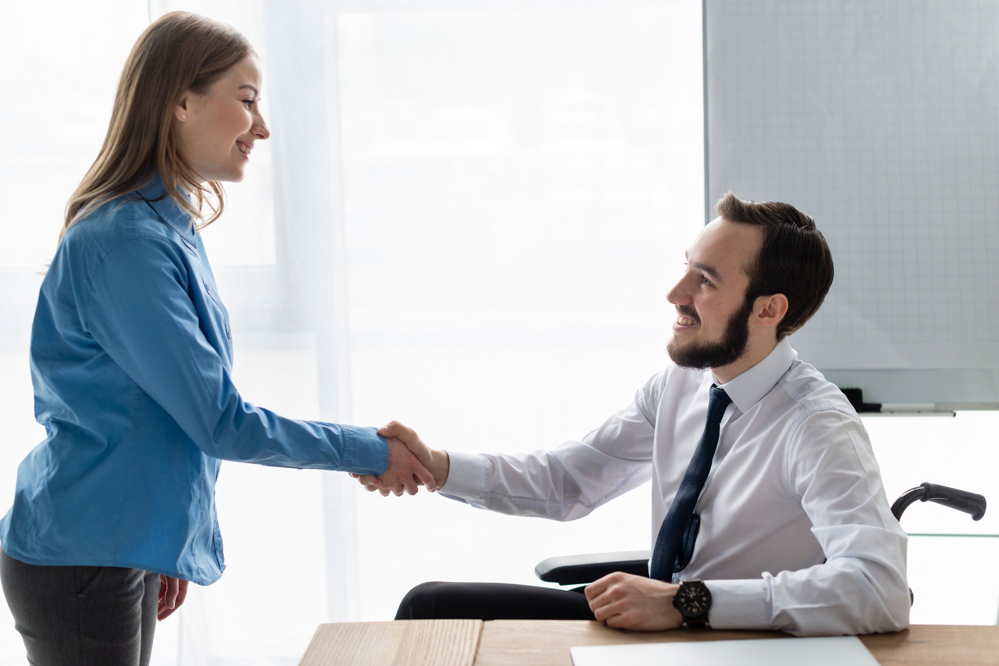 positive-woman-man-shaking-hands-together